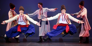  The solist dancers Kirill Kochubey and Evgueni Chernyshkov. The performance of the Ballet Igor Moïsseïev at the Palais de Congres in Paris. 20.12.11